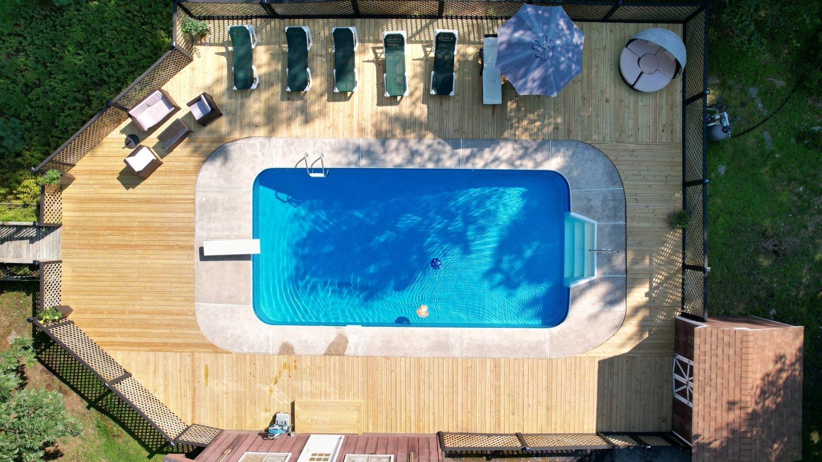 Backyard pool and deck shot from directly overhead